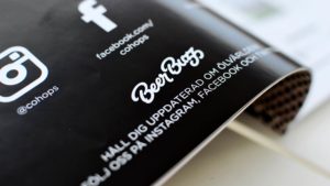 Beer Buzz logo in printed magazine.