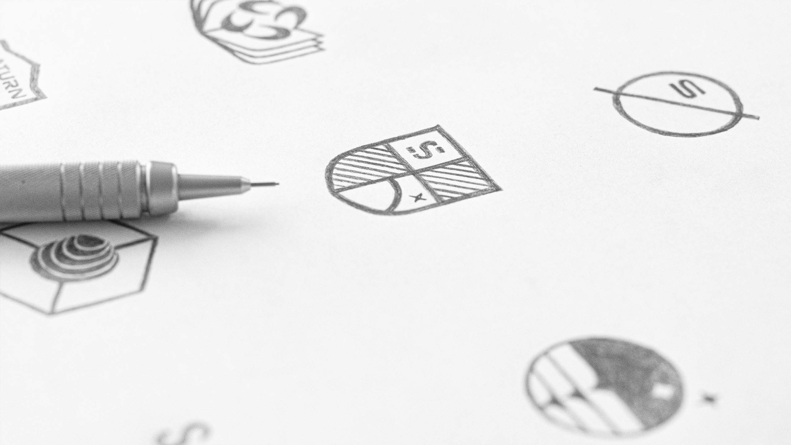 Hand-drawn sketches for the IES logos.