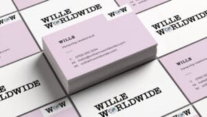 Mockup of business cards with the Wille Worldwide logo.